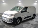 the white van is parked in a clean room with checkered floor
