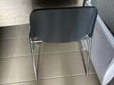 a chair that is sitting in front of a desk