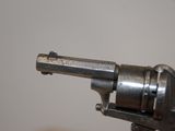 a small gun that is sitting on a table