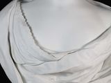 a statue of a woman that is wearing a white dress