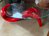 a glass table with a red object on top of it