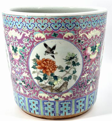 a colorful vase with a bird and flowers on it