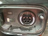 a close up of a car ' s fuel tank with a car key in it