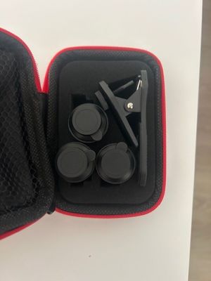 a black and red case with a pair of scissors in it