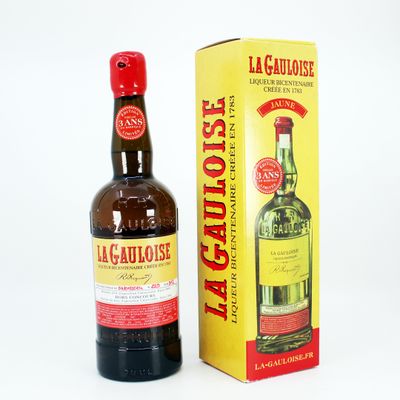 an image of a bottle of liquor next to a box of liquor