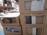 boxes stacked on top of each other on a floor in a warehouse