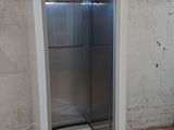 a refrigerator that is sitting in the middle of a room