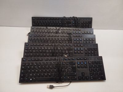 a black keyboard that is sitting on a white table