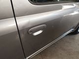 a close up of a car door handle with a sticker on it