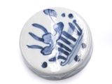 a picture of a blue and white plate with a bird on it