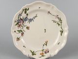 an image of a plate with flowers painted on it