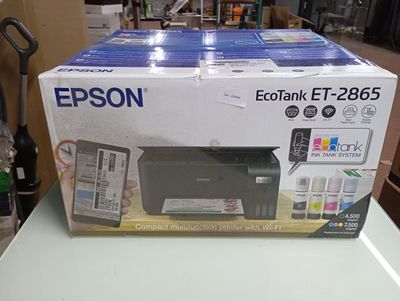 a box with a printer on top of it on a table