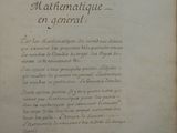 an old book with writing on it sitting on top of a table