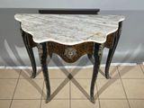 a marble top table with a metal frame and legs