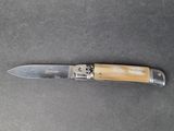 a knife that is laying on a table