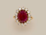 a ruby and diamond cluster ring