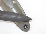 a knife that is laying on top of a knife holder