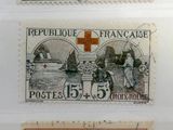 four different postages from different countries with a cross on them