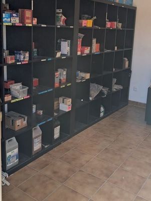 a room with a lot of books on the shelves