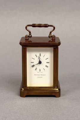 a small clock that is sitting on a table