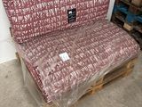 a couch that is wrapped in plastic and sitting on a pallet