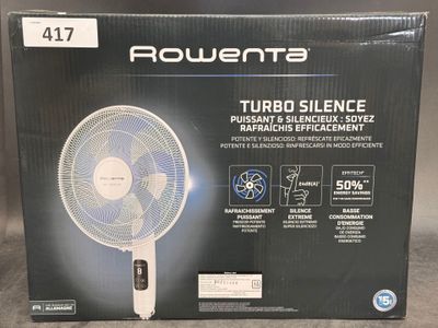 a box of a white table fan sitting on top of a table