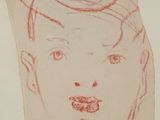 une image représentant le dessin du visage d'un enfant sur une feuille de papier