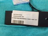 a close up of a label on the back of a blue shirt
