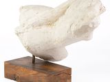 marble sculpture of a bird on a wooden base on a white background