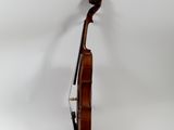 a close up of a violin on a white surface with a white background