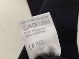 the label on the back of a black dress