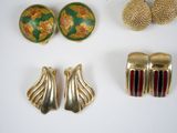 several pieces of jewelry including earrings, rings, and brooches