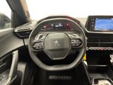 the interior of a car with a steering wheel, dashboard, and display screen