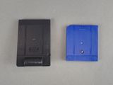 two game cartridges sitting next to each other on a table