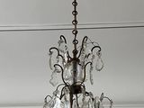 a chandelier hanging from the ceiling in a room