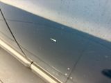a car door with a small hole in the side