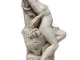 an image of a statue of a woman sitting on top of a rock