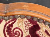 a close up of a chair with a red and white pattern