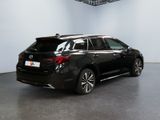 the rear end of a black toyota highland parked in a room