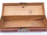 a small wooden box with a latch on the inside
