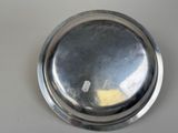 a silver plate with a yellow piece in it