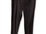 the black pants are hanging on a hanger on a white wall