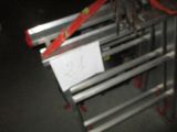 a picture of a metal shelf with a sign on it