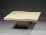 a close up of a wooden table with a square base