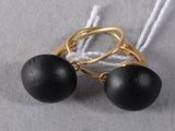 pair of black bead earrings with gold plated hoops on a white string
