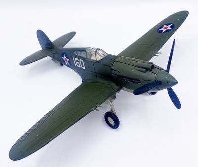 a toy airplane that is sitting on a white surface