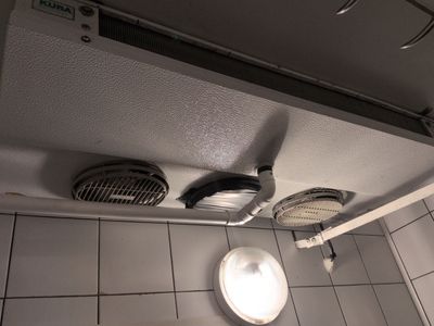 two exhaust fans on the ceiling of a bathroom