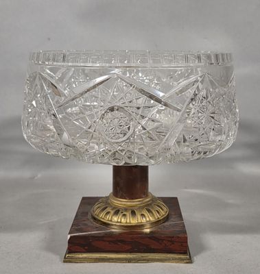 an image of a glass bowl sitting on top of a wooden base