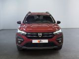 a red car is parked in a room with a white wall