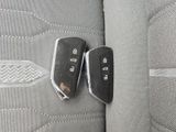 two car keys that are sitting on the seat of a car